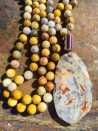 Long necklace of natural jasper ochre stones
