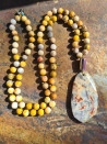 Long necklace of natural jasper ochre stones