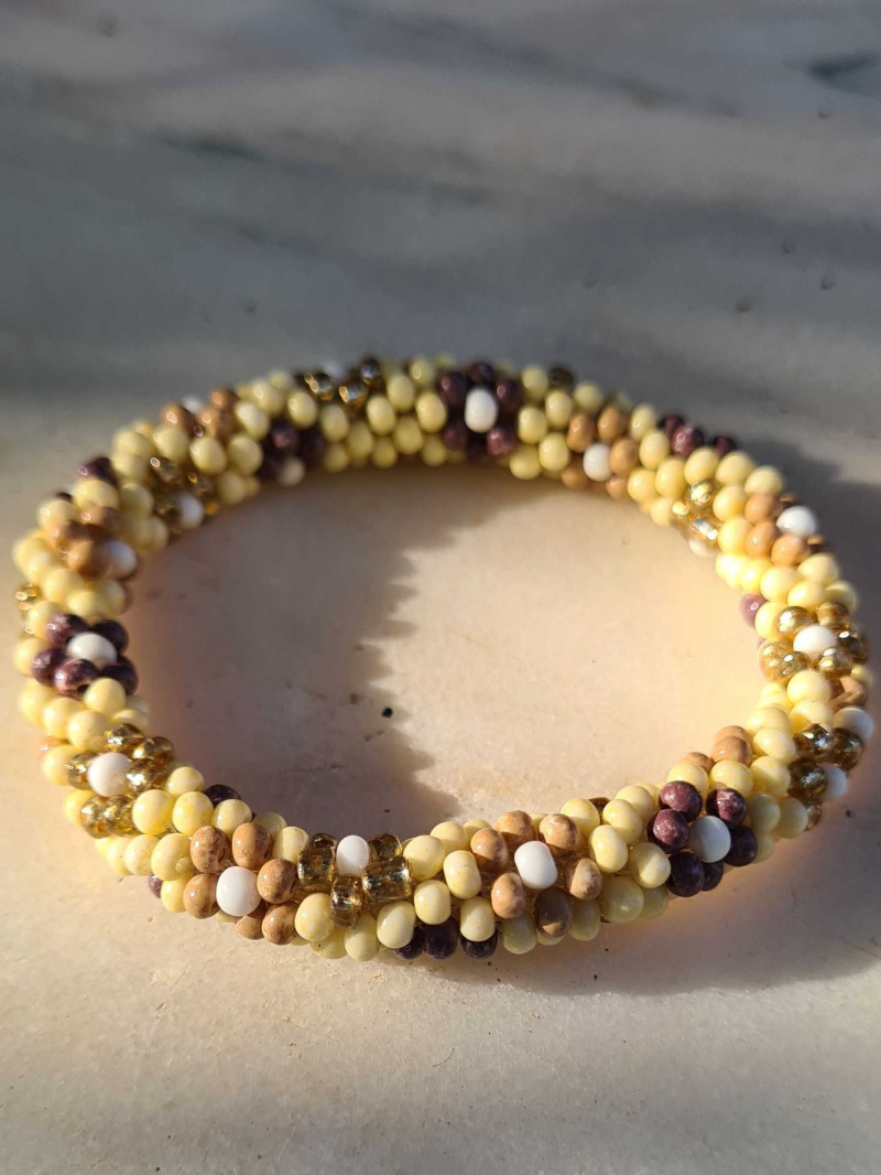 Elastic bracelet with rock crystals and flowers in PEYOTE technique