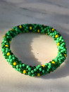 Pulsera elástica con cristales roca y flores en técnica PEYOTE
