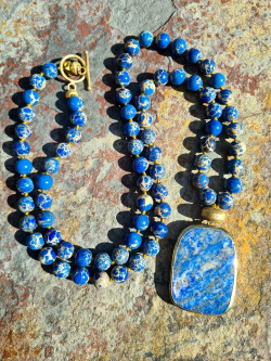 Long necklace with natural blue sedimentary stones and a lazurite pendant.