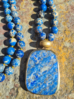 Long necklace with natural blue sedimentary stones and a lazurite pendant.