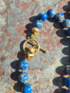 Long necklace with natural blue sedimentary stones and a lazurite pendant.