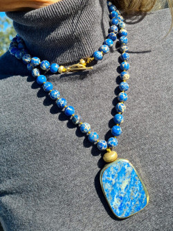 Long necklace with natural blue sedimentary stones and a lazurite pendant.