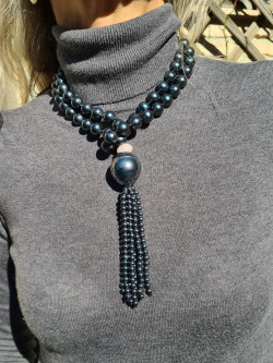 Long necklace of mother-of-pearl beads with tassel