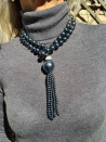 Long necklace of mother-of-pearl beads with tassel