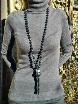 Long necklace of mother-of-pearl beads with tassel