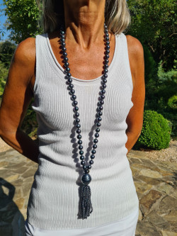 Long necklace of mother-of-pearl beads with tassel