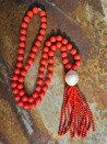 Long necklace of mother-of-pearl beads with tassel
