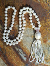 Long necklace of mother-of-pearl beads with tassel