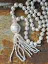 Long necklace of mother-of-pearl beads with tassel