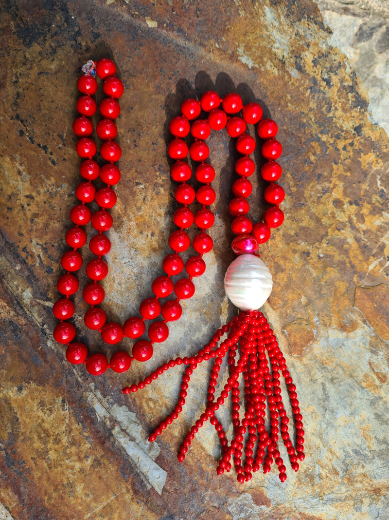 Long necklace of mother-of-pearl beads with tassel