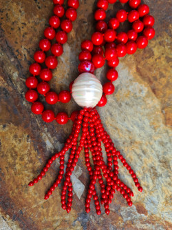 Long necklace of mother-of-pearl beads with tassel