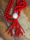 Long necklace of mother-of-pearl beads with tassel