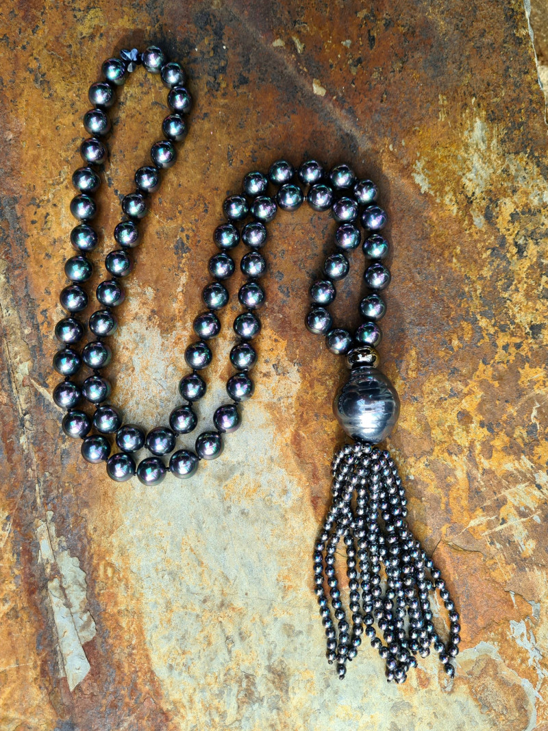 Long necklace of mother-of-pearl beads with tassel