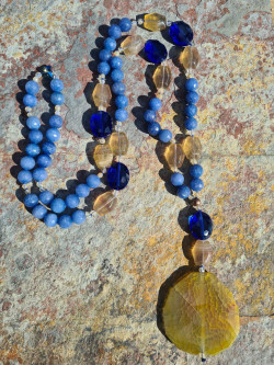 Long necklace of blue agates and amber agate pendant