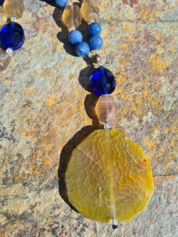 Long necklace of blue agates and amber agate pendant