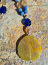Long necklace of blue agates and amber agate pendant