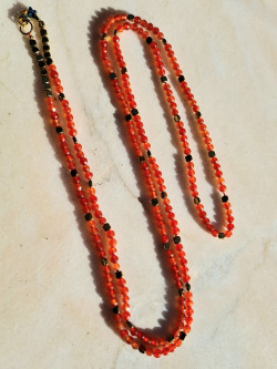 Long necklace of natural orange stones and golden hematite pieces