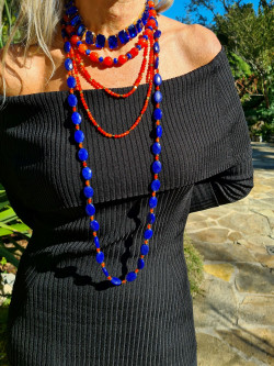 Long necklace of natural orange stones and golden hematite pieces