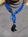 Long necklace with blue cat's eye and black agate pendant
