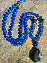 Long necklace with blue cat's eye and black agate pendant
