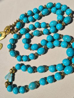 Long ethnic necklace with turquoise howlite and cactus pendant