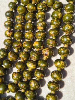 Long necklace of khaki-dyed bone with yellow spots