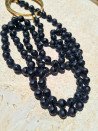 Long black agate necklace with hoop and bronze pieces
