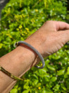 Open steel bracelet with elegant gold or silver pearls