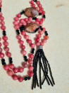Long pink agate necklace with black Czech crystals and a tassel