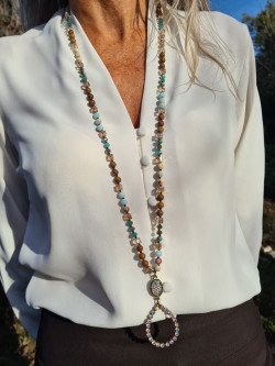 Long necklace of agate and crystals with a handmade oval pendant