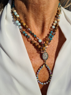 Long necklace of agate and crystals with a handmade oval pendant