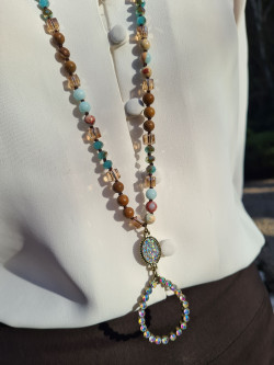 Long necklace of agate and crystals with a handmade oval pendant