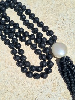 This long necklace made of black volcanic lava is handcrafted