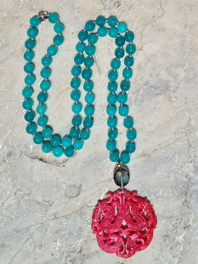 Long agate necklace with vibrant colored jade medallions