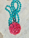 Long agate necklace with vibrant colored jade medallions