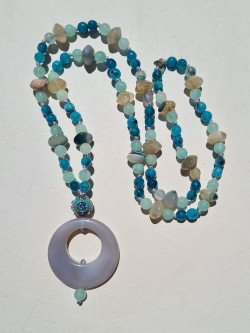 Long necklace of blue and gray agates with agate circle pendant