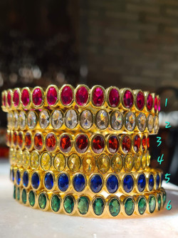 Rigid gold bracelets with colorful cubic zirconia