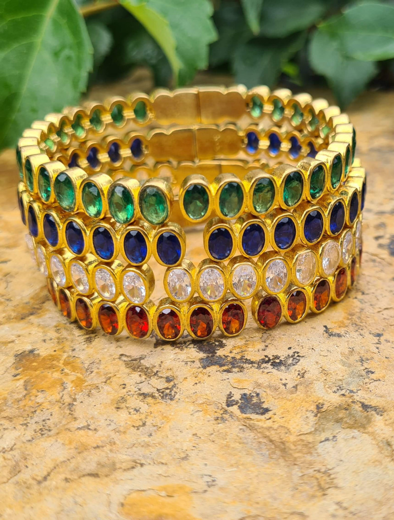 Rigid gold bracelets with colorful cubic zirconia
