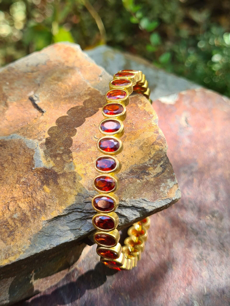 Rigid gold bracelets with colorful cubic zirconia