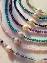 Necklaces of agate and baroque pearl in delicate tones