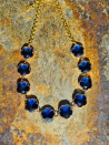 Short choker necklace with blue flower-shaped crystals