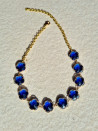 Short choker necklace with blue flower-shaped crystals