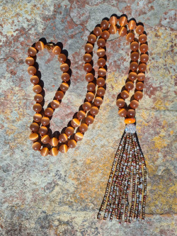 Long cat's eye necklace with a crystal tassel