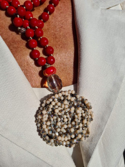 Long necklace of red agates with crystal flower pendant