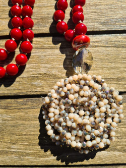 Long necklace of red agates with crystal flower pendant