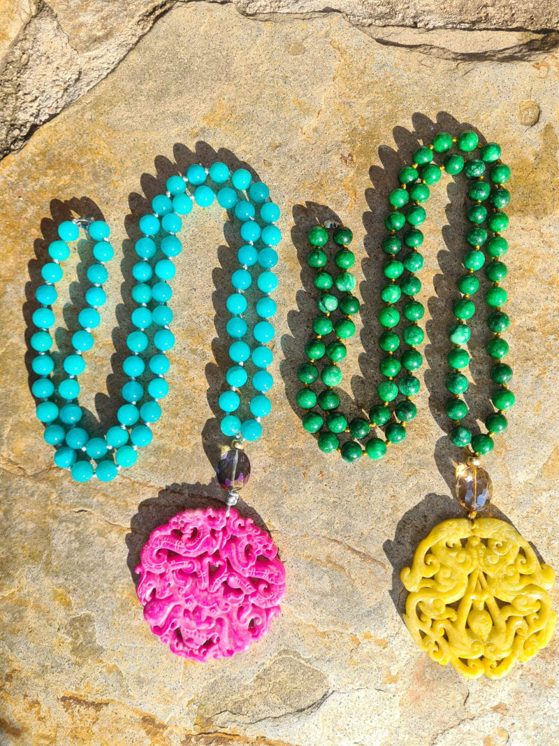 Long agate necklace with vibrant colored jade medallions