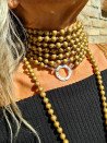 Very long necklace with gold-plated wooden beads and a lobster clasp