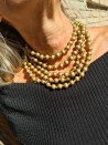 Very long necklace with gold-plated wooden beads and a lobster clasp